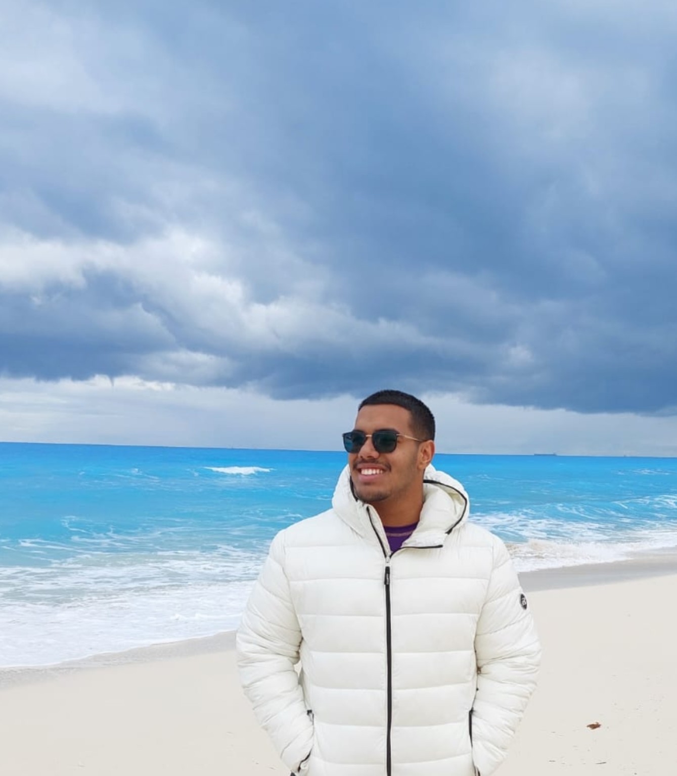 Adam Mahfouz on a beach