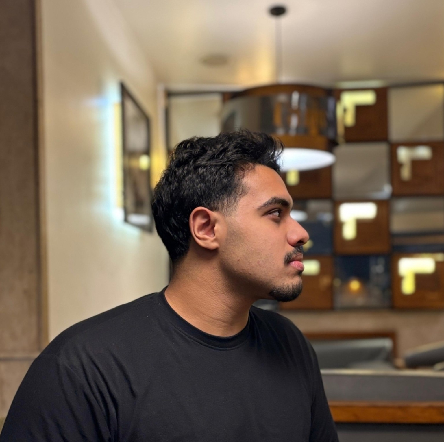 Adam Mahfouz in a black shirt